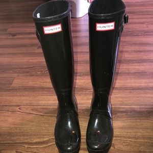 Tall black hunter boots